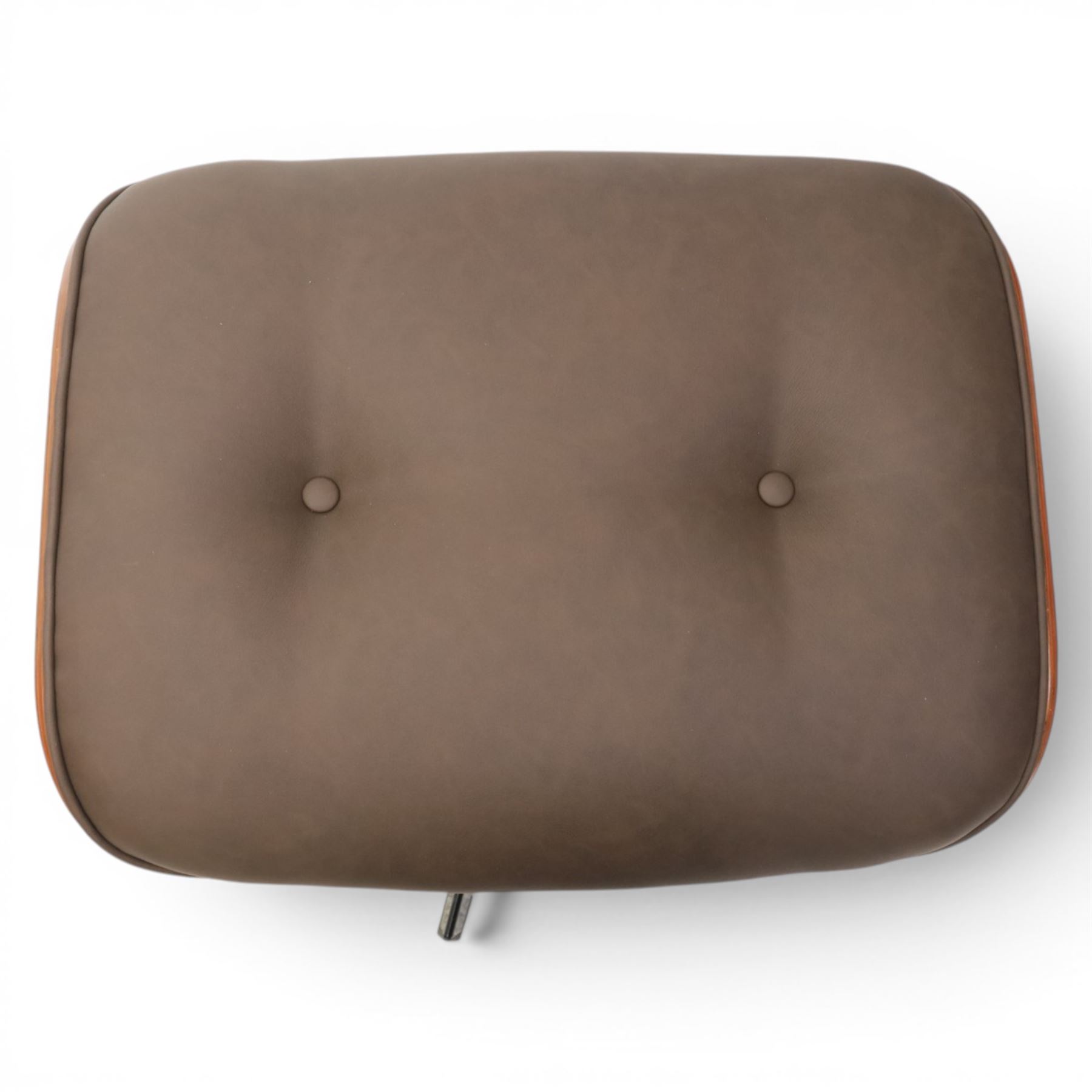 In the manner of Eames' Lounge chair, contemporary brown leather and plywood recliner and footstool, padded leather seat and arm rests, plywood backs raised on a black metal frames, reclines and swivels on a five point base  