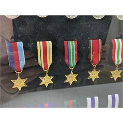 Limited edition large framed display board with sixty half-size copies of British Gallantry and Campaign Medals produced by Danbury Mint; all with ribbons and associated booklet