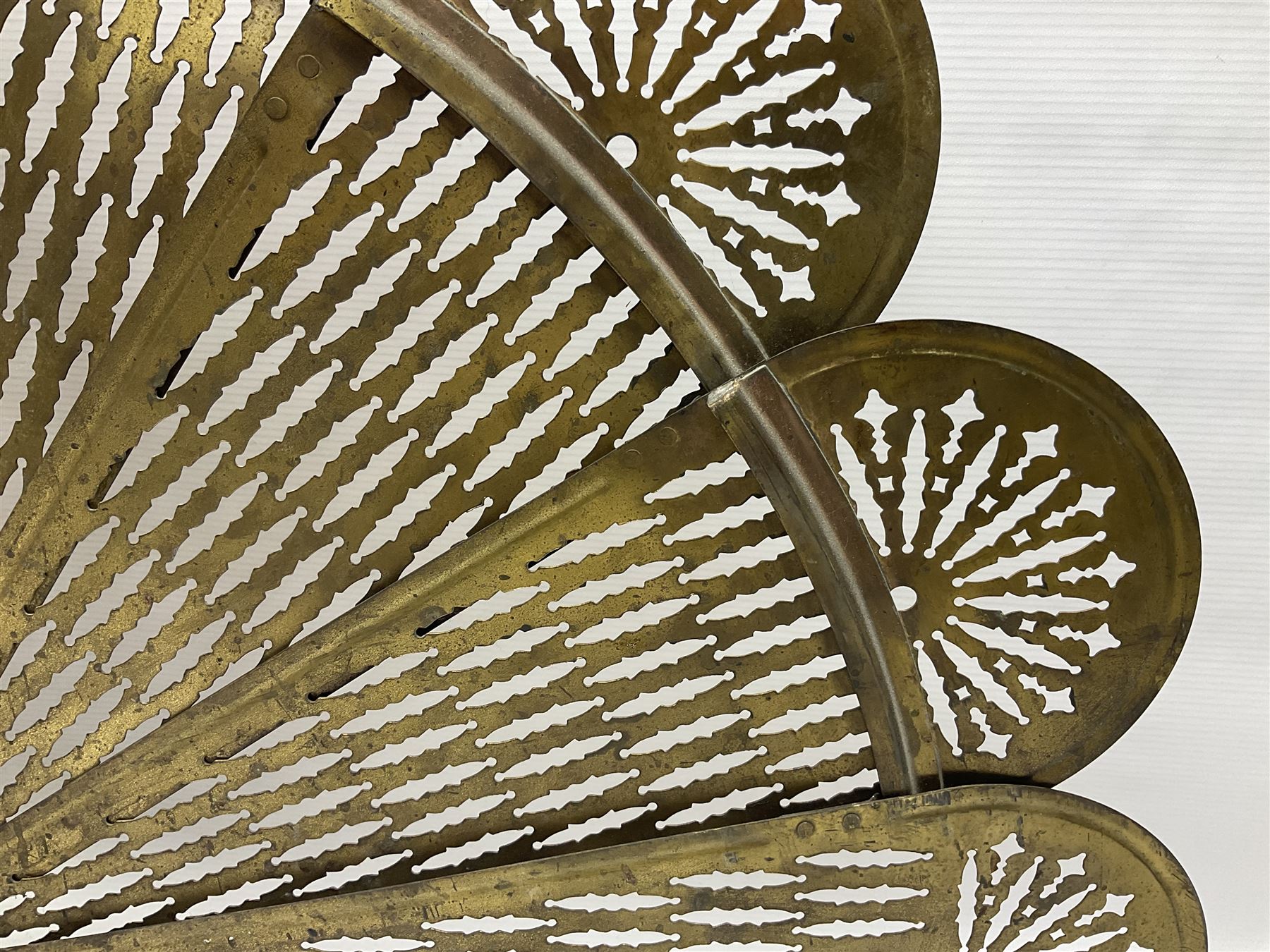 Pierced brass peacock style folding fire screen, with urn finial, H65.5cm