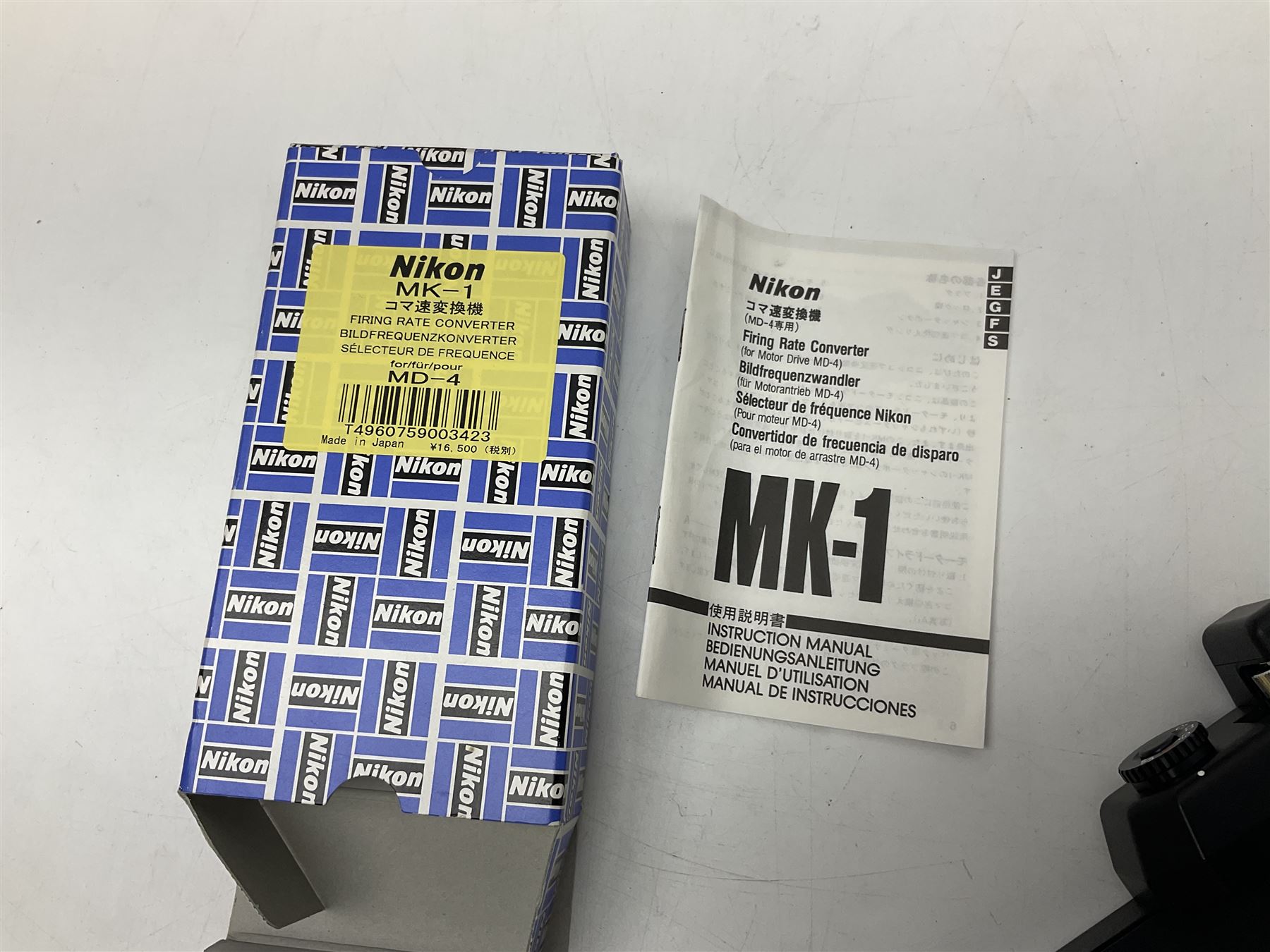 Nikon F3T camera body, in champagne/ titanium colourway, serial no. T8215031, with 'Nikon Nikkor 50mm 1:1.4' lens, Nikon MD4 motor drive, serial no. 156592 and Nikon MK-1 Firing range converter, all with original boxes 