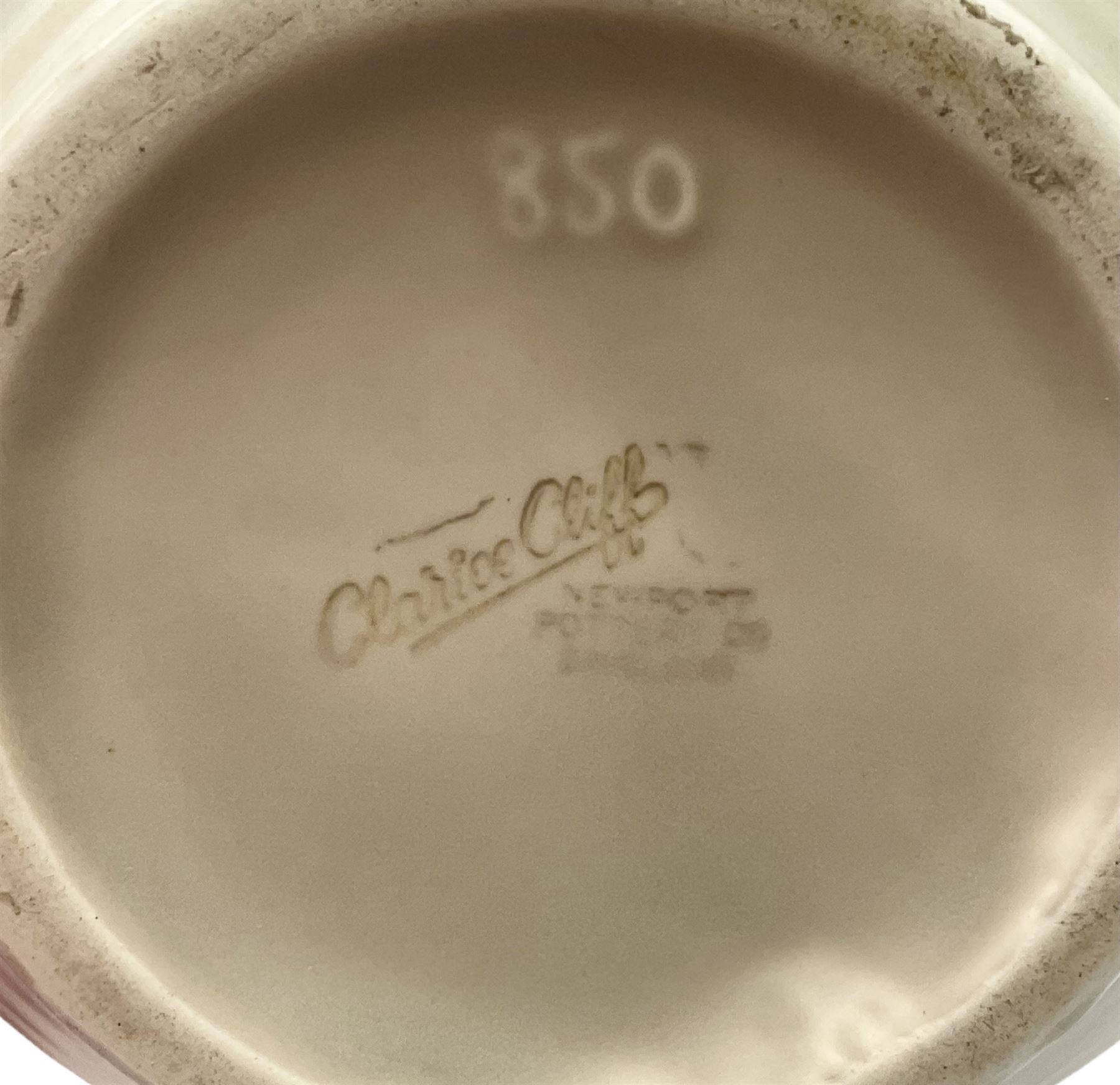 Clarice Cliff baluster jug moulded with a blue budgerigar perched upon branch with green rustic handle and mushroom glaze,  factory stamped beneath, H22.5cm