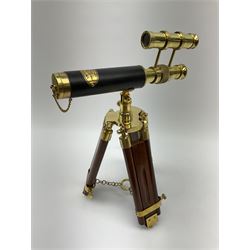Reproduction telescope on tripod stand, plaque to the top reading 'Victorian Marine Telescope London 1915', H34cm