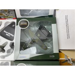 Fourteen die-cast models of aircraft including four Oxford Aviation, two Military Giants of the Sky, two Ixo Models, Corgi Warbirds Messerschmitt, Atlas Editions Spitfire and Messerschmitt, two Hobby Master etc; and two die-cast models of tanks; all boxed (16)