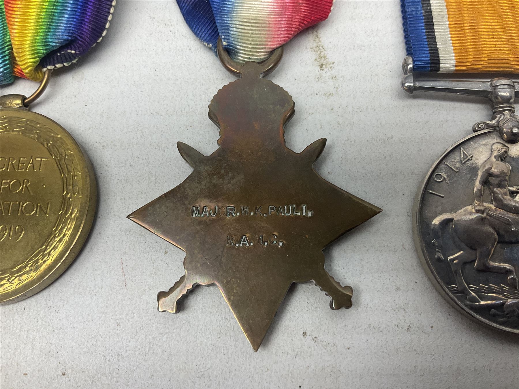 WW1 group of three medals comprising British War Medal, 1914-15 Star and Victory Medal awarded to Major W.K. Pauli R.A.M.C.; with ribbons; some biographical details