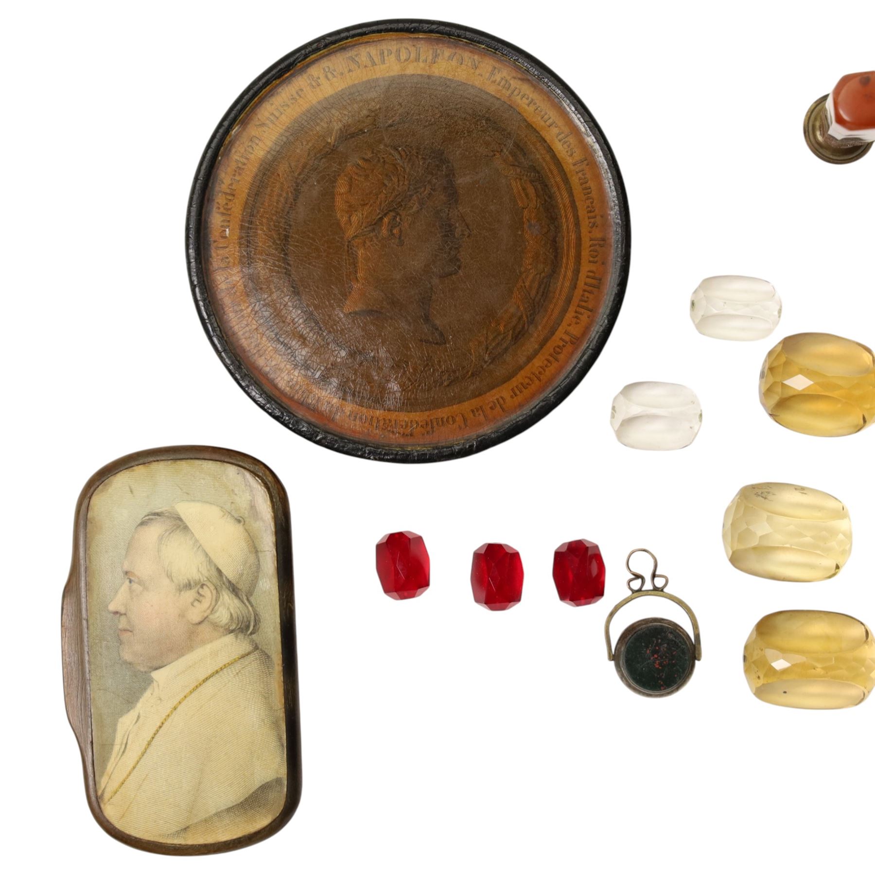19th century papier mache snuff box, the cover with a papal figure, possibly Pope Pius, a French circular snuff box decorated with details of the life of Napoleon Bonaparte, pinchbeck seal, agate desk seal and various others