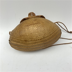 A lady's shoulder bag of rugby ball shape formed from a lined armadillo skin with head and limbs, enamelled clasp, inset glass eyes and plaited strap, W25cm.