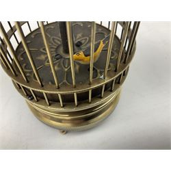 Automation bird cage of predominantly brass construction with central rotating orb and bird with painted decoration, H15cm