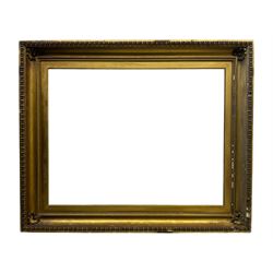 Large early 20th century gilt picture frame, with floral moulded corners and egg and dart moulding to the edge, aperture 78cm x 98cm, inner slip aperture 70cm x 91cm, overall 97cm x 118cm