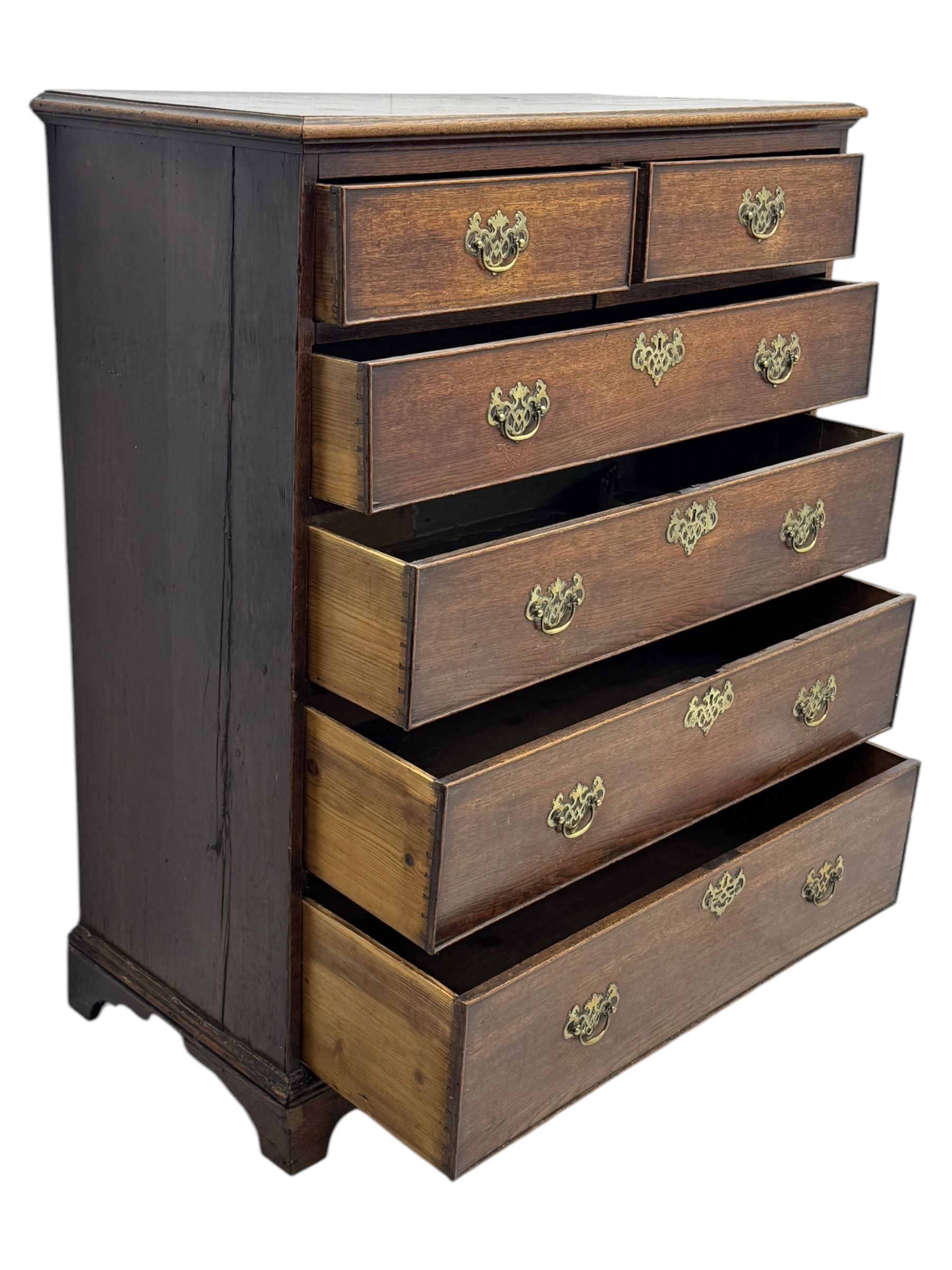 George III oak chest of drawers fitted with two short over four long drawers fitted with swan neck handles, supported on bracket feet