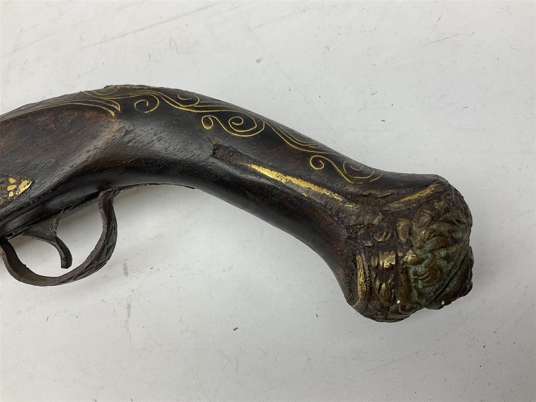 REGISTERED FIREARMS DEALERS ONLY - Reproduction flintlock pistol, the full walnut stock with brass filigree inlay and mounts and skull crusher butt L46cm; no visible proof marks - Disposed 25.06.25 - Notified 24.07.25