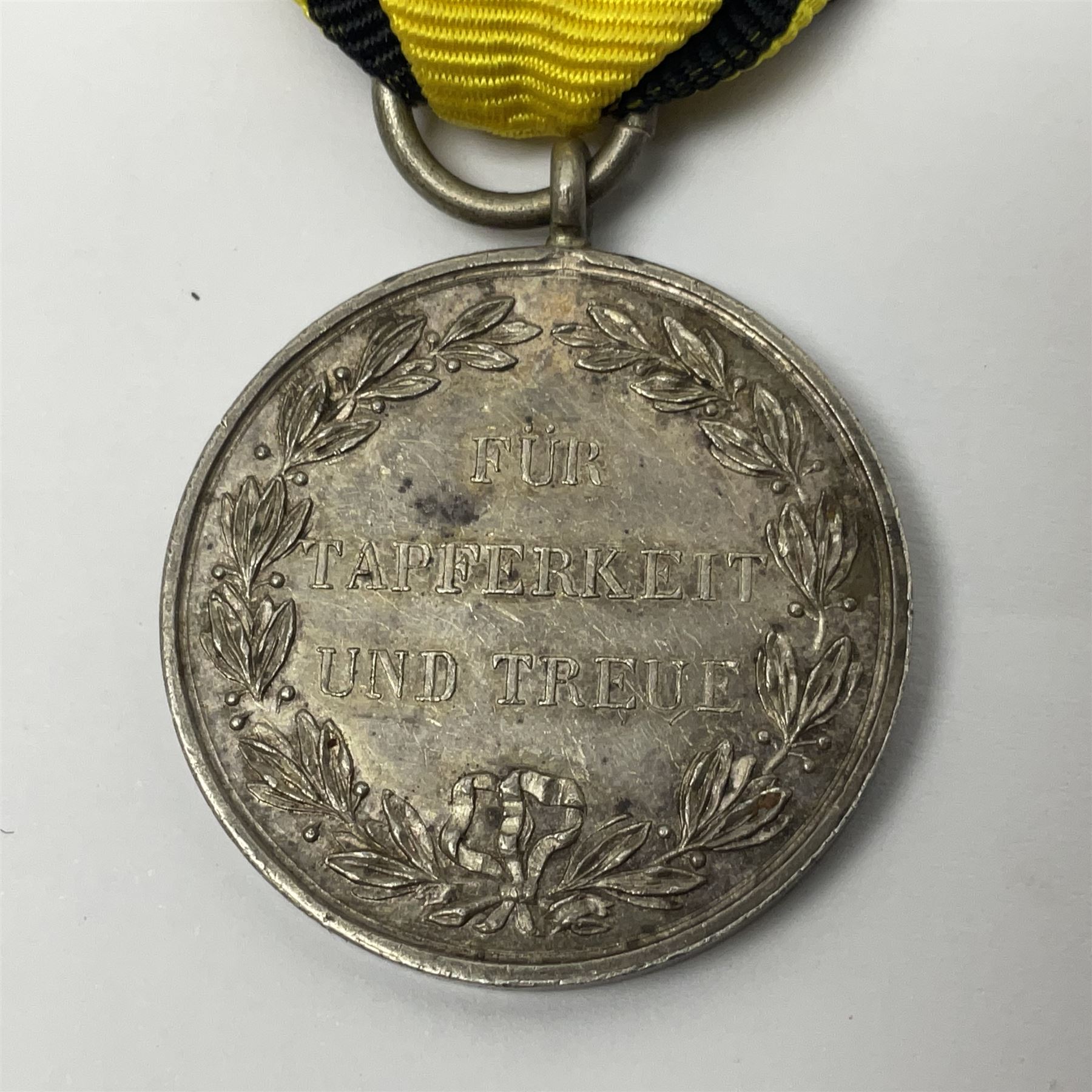 WWII German Iron Cross 2nd Class with ribbon; WWI German Wuerttemberg Medal with ribbon; and Day Badge for 1934 marked Reichsverband Pforzheim32 (3)