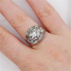 George III gold and silver old cut diamond cluster ring, the principal diamond of approx 0.75 carat, with pave set old cut diamond surround

