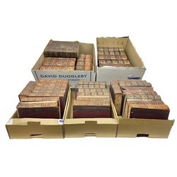 Thirty six volumes of Encyclopaedia Britannica with gold tooled red leather spines in various editions 