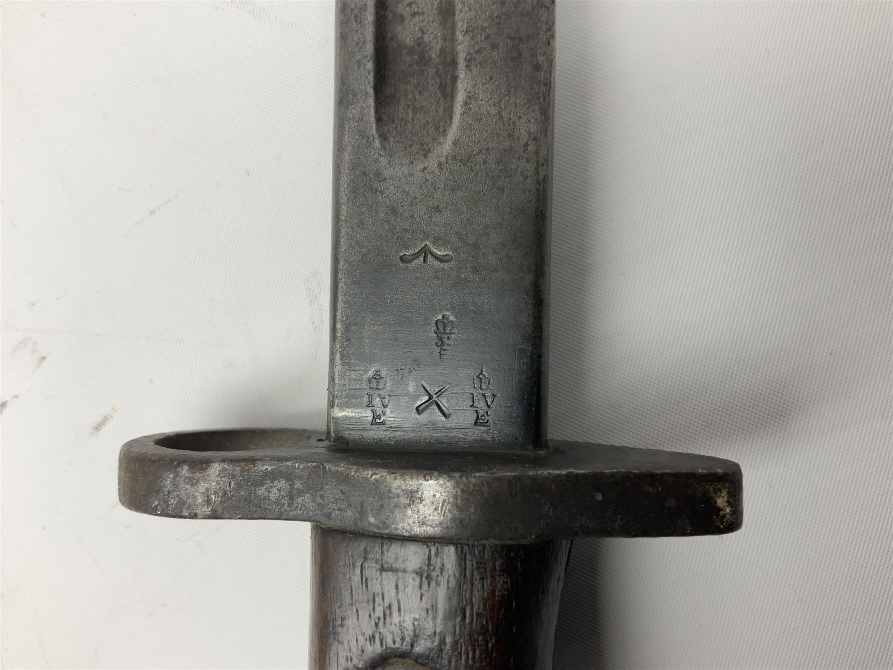 British Enfield 1907 model SMLE bayonet, with 43cm fullered steel blade and metal mounted leather scabbard L58cm overall; and Schmidt-Rubin Model 1918 bayonet the 30cm steel blade marked Elsener Schwyz No.579722; in steel scabbard with leather frog marked G. Bertolini Sellaio Vira/G.Tic 79 L45cm overall (2)