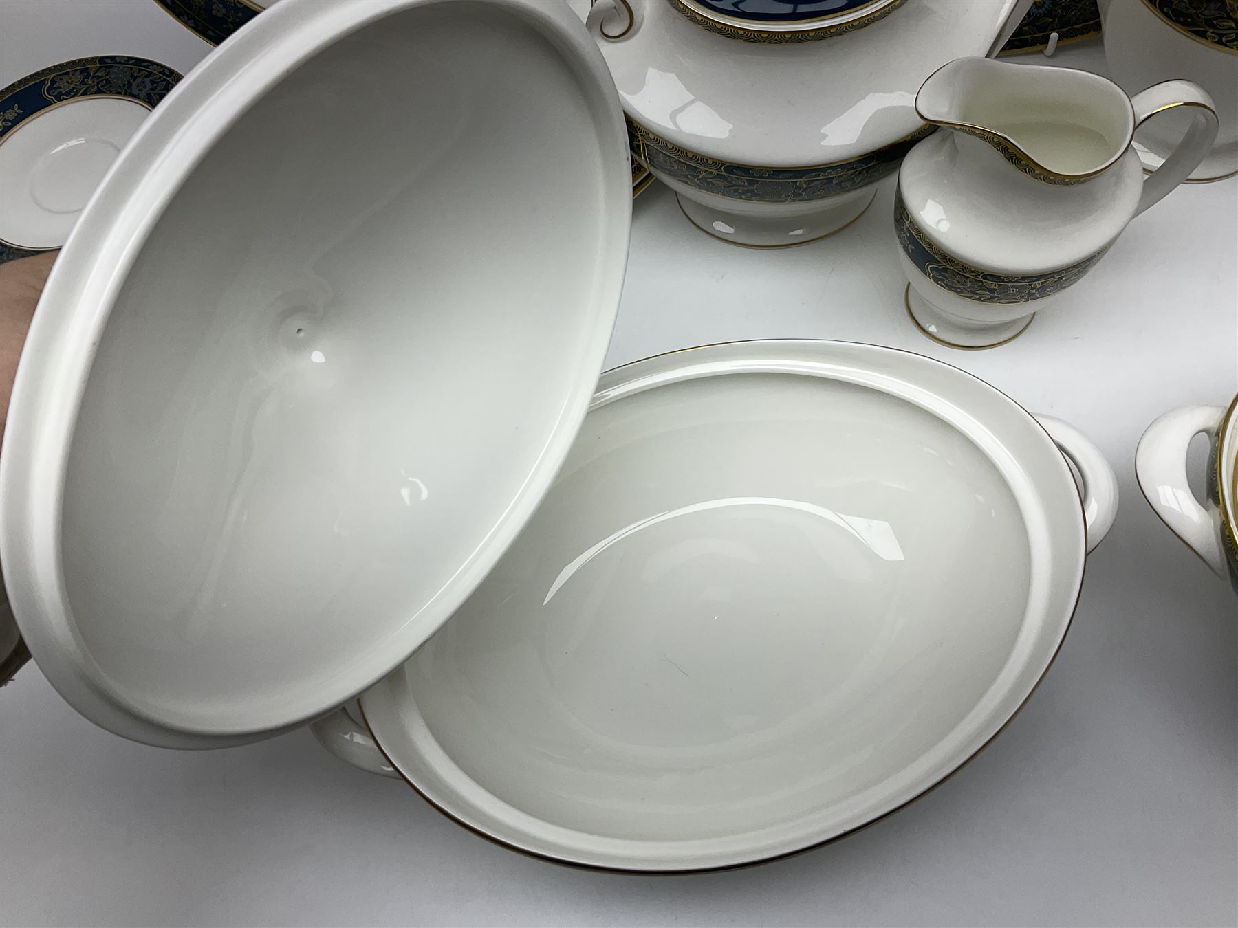 Royal Doulton Carlyle pattern tea and dinner service for six, to include teapot, coffee pot, teacups and saucers, coffee cups and saucers, milk jug, open sucrier, dinner plates, side plates, bowls, soup bowls, to covered dishes etc (64) 