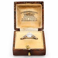 Early 20th century platinum diamond ring, four claw set with a single old cut diamond of approx 0.90 carat and diamond set shoulders, stamped Plat, inscribed with initials and dated 7.6.28