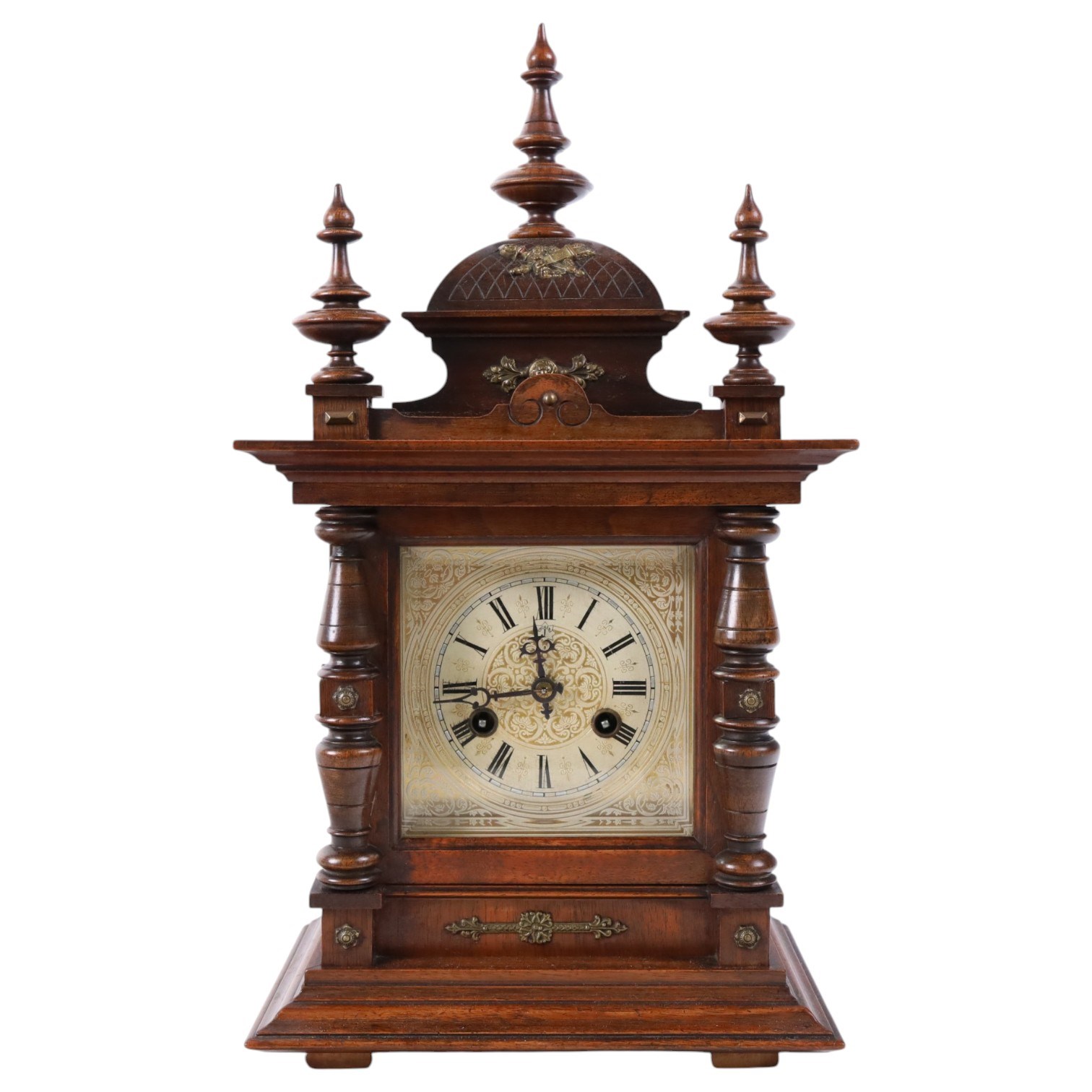 Junhgans eight-day cased mantle clock, with a square etched dial and Roman Numerals, a carved ogee pediment and turned finials, on a broad blinth with bun feet, H49cm