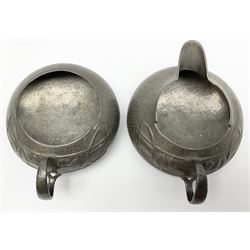 Archibald Knox for Liberty & Co Tudric pewter three piece tea service, comprising teapot with woven reed handle, single handled open sucrier, and milk jug, each with planished finish and detailed with honesty flowers, each impressed beneath Made in England Tudri Pewter 0231 