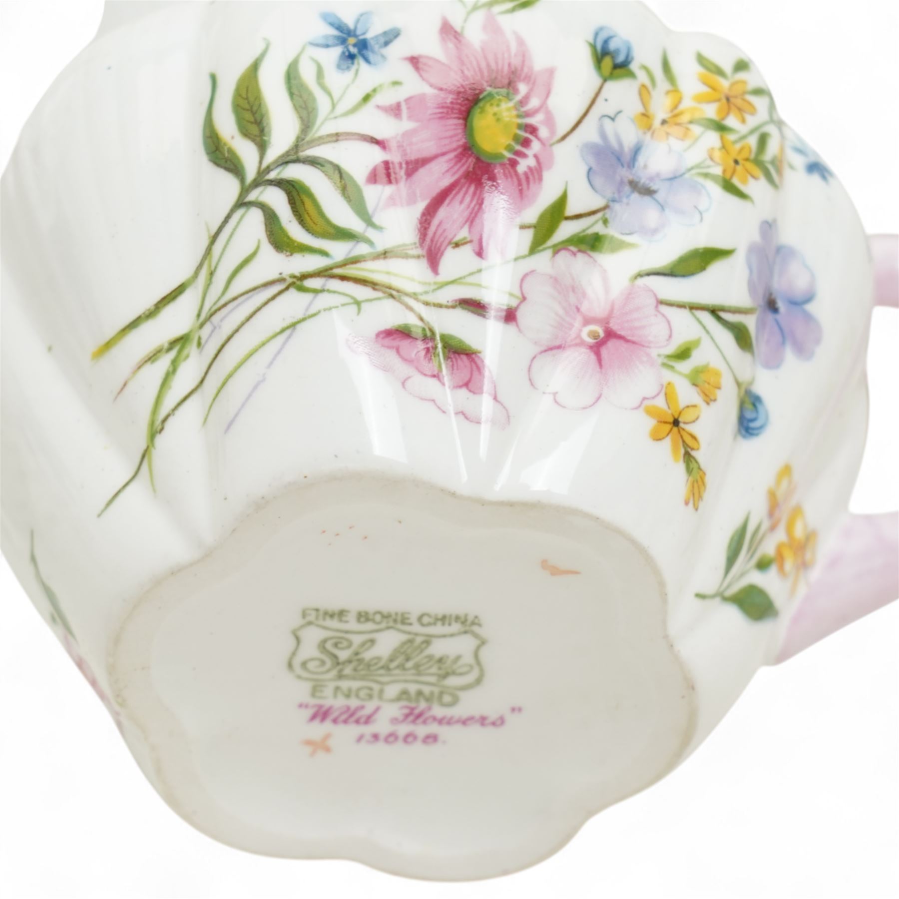 Shelley 'Wild Flowers' pattern part tea service, comprising four coffee cups, five coffee cup saucers, nine teacups, eight teacup saucers, coffee pot, three milk and cream jugs, two bowls, five cake plates etc