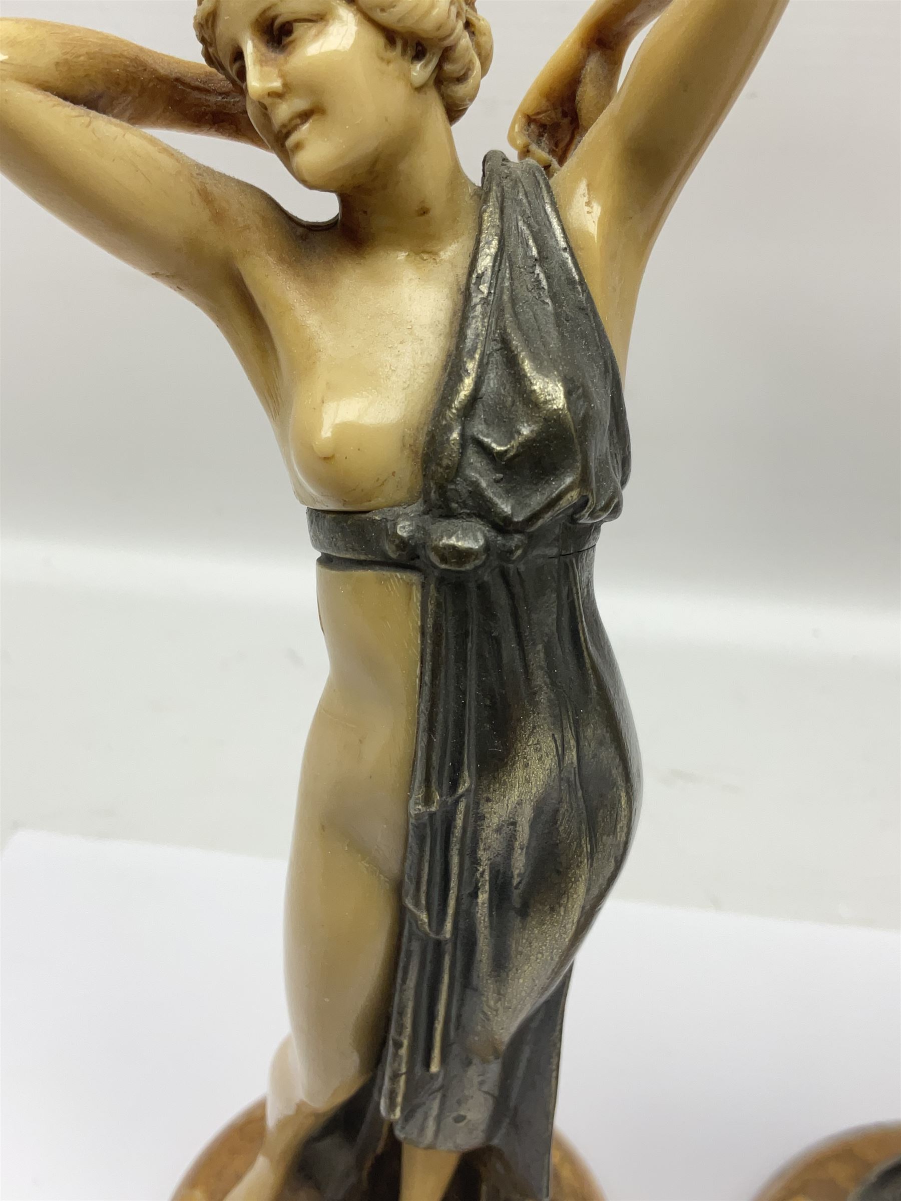 After Ferdinand Preiss (1882-1943), pair of Art Deco style, composite semi nude classical female figures, raised on circular onyx bases, H21cm