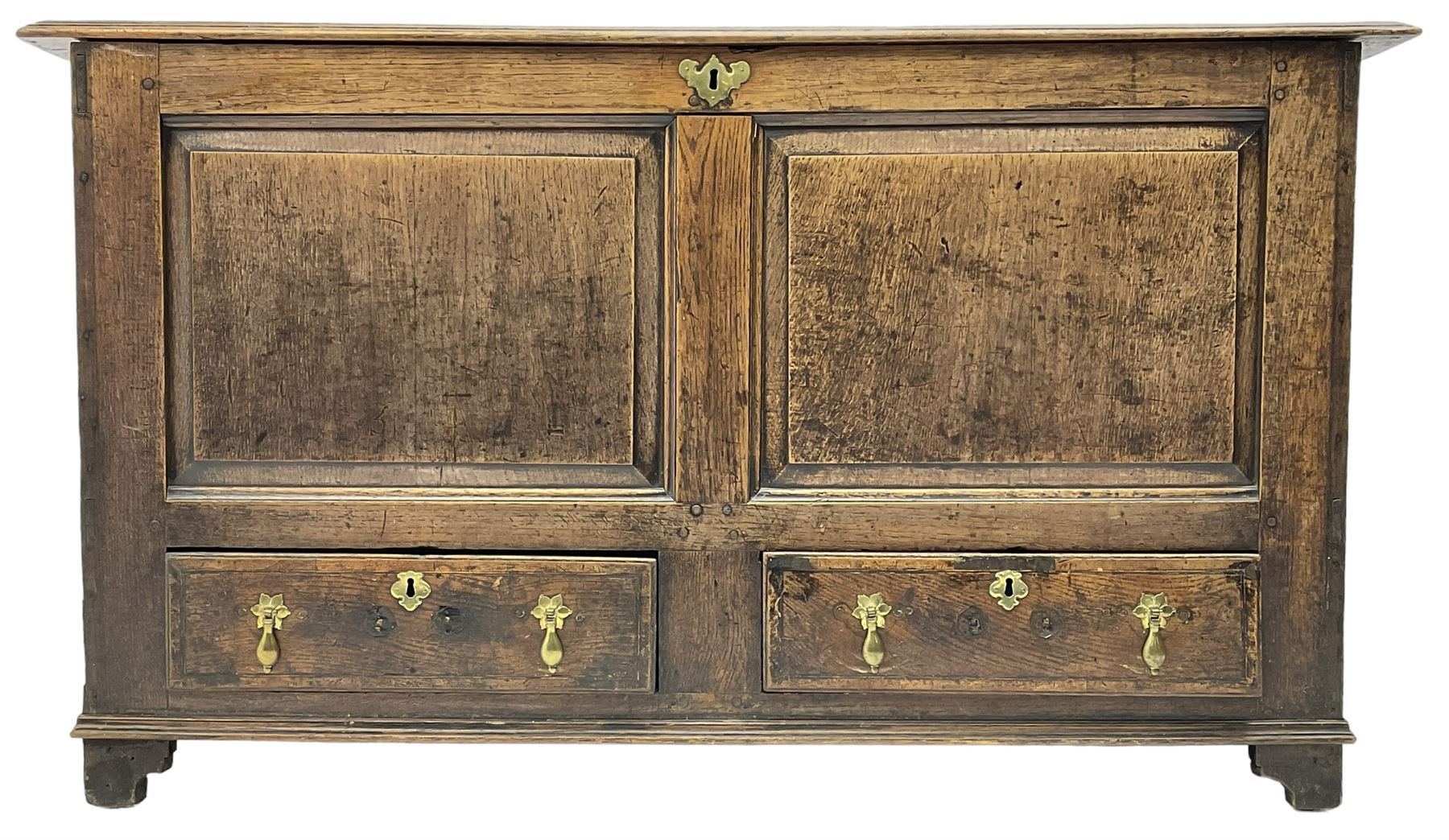 18th century oak mule chest, moulded hinged lid over panelled front, fitted with two moulded drawers
