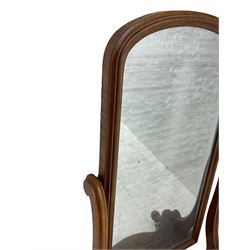 Victorian mahogany cheval dressing mirror, arched mirror in moulded frame, serpentine supports on shaped platform, on splayed feet with ceramic castors