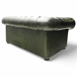 Thomas Lloyd - two-seat hardwood-frame Chesterfield sofa, traditional rolled back and arms upholstered in deeply buttoned green leather, on turned bun feet 