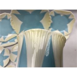 Shelley Dainty pattern tea wares, of lobed form with blue star decoration on merging white and yellow ground, comprising five teacups, five saucers, six tea plates, milk jug and cake plate, all with printed green mark beneath, some with painted pattern no 11770