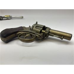 Early 20th century Flobert 5mm blank firing revolver with six-shot chamber, top venting, nickel plated with folding trigger No.118 L12.5cm overall; replica non-firing 'British Bulldog' revolver; and Windproof gas lighter inscribed 'Revolver-99 Spring and Autumn' in holster marked 'Star-Line'