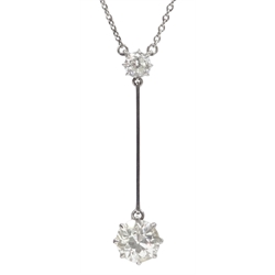  White and yellow gold two old cut diamond drop pendant necklace, the lower larger diamond approx 1.10 carat  