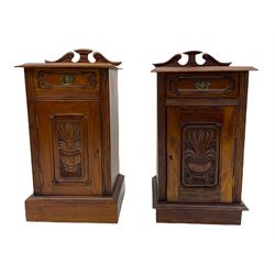 Pair Victorian style hardwood bedside cabinets, fitted with single drawer and cupboard, the doors carved with floral urns, on plinth bases