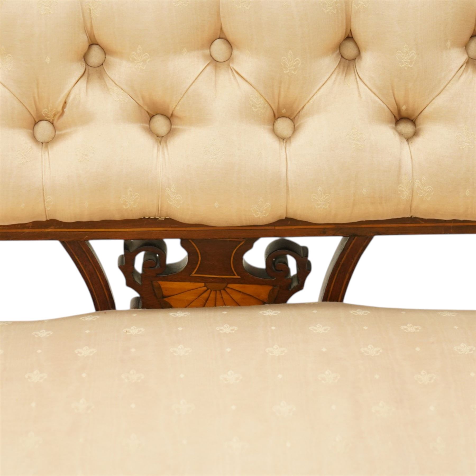 Edwardian inlaid mahogany sofa, upholstered in cream fabric with buttoned back rail, tapering legs on brass castors