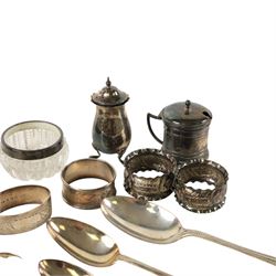 Collection of silver, including pepper shaker, mustard pot, three spoons, two silver collared glass salts and six napkin rings, all hallmarked 