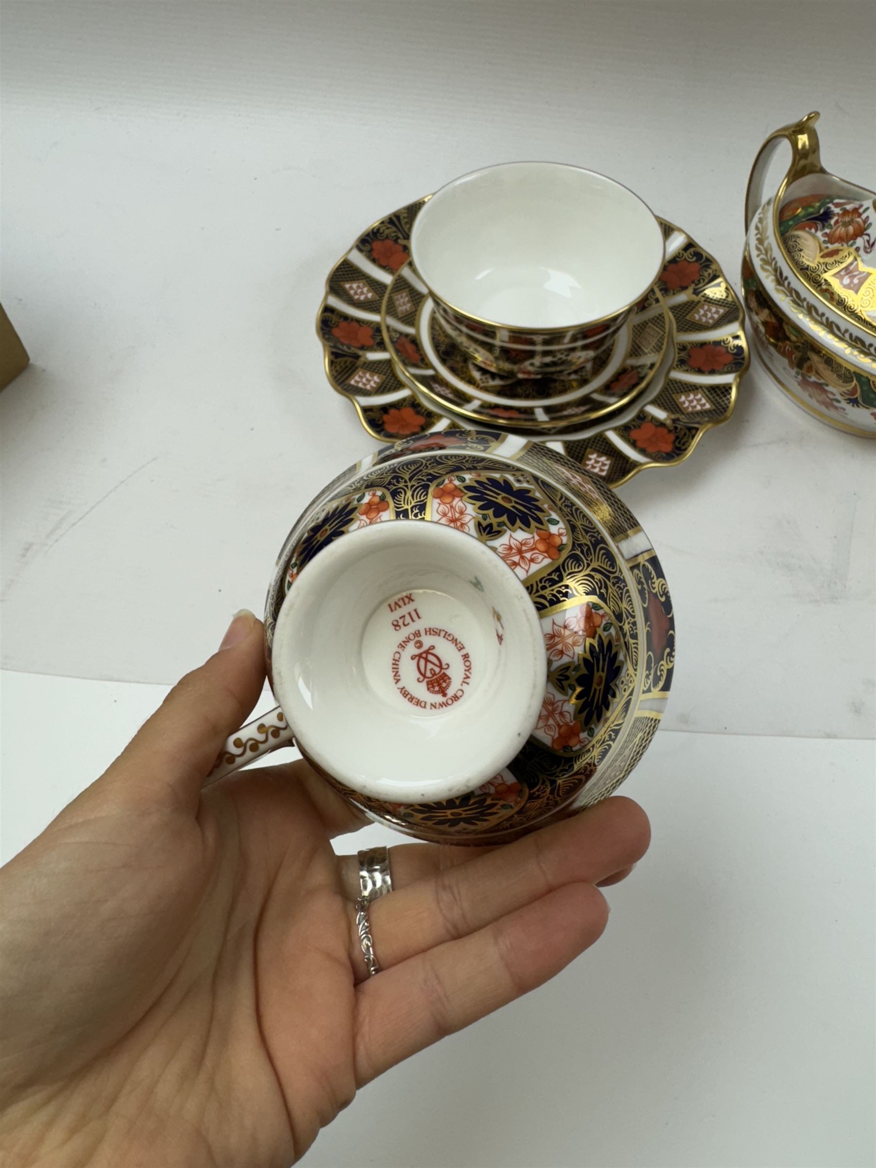 Royal Crown Derby 1128 Old Imari pattern, teacup and saucer, plate with fluted edge and open sucrier, together with spode twin handled sucrier