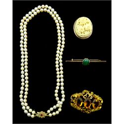 Double strand cultured pearl necklace, with 9ct gold garnet and split pearl clasp, hallmarked, Victorian gold carved ivory brooch depicting flowers, gold malachite brooch and a pinchbeck brooch set with three citrines