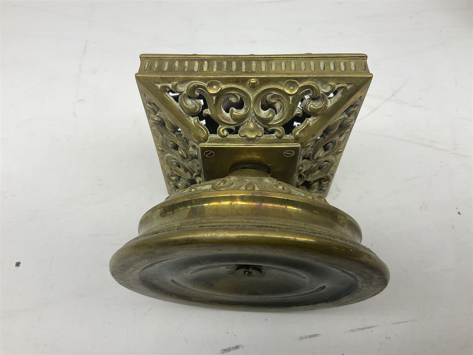 Collection of victorian and later brass desk accessories, to include a letter holder with cherub design, ink well of square form with hinged lid, brass table bell, brass casket with relief decoration, etc  