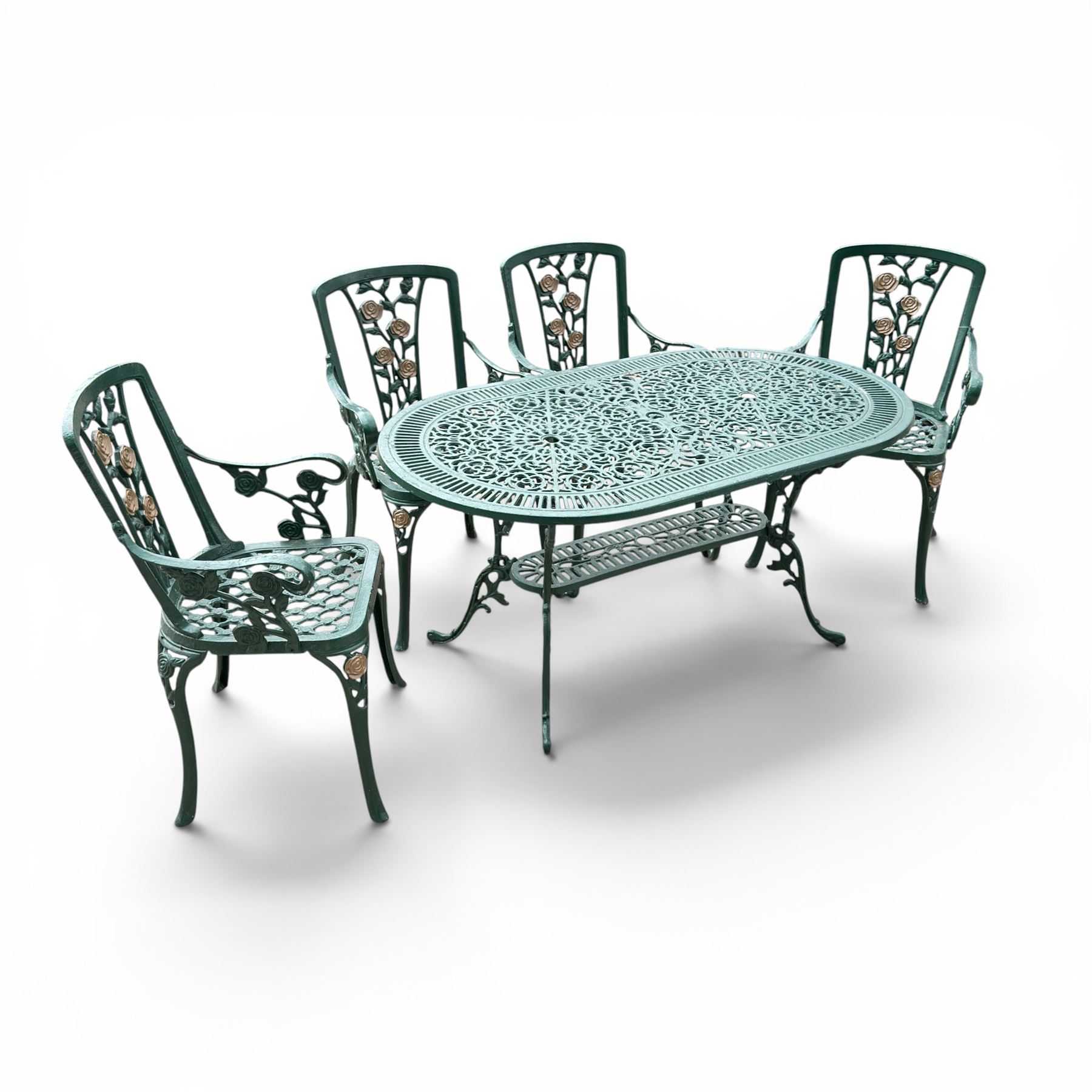 Cast aluminium oval garden table and set of four armchairs with pierced rose design back splats