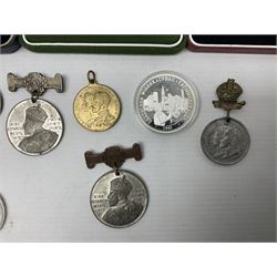 Quantity of commemorative medals and coins, to include cased Royal Mint 400th Anniversary of the Translation of the Bible to Welsh, Millennium 2000, 1970 World Cup Winston etc