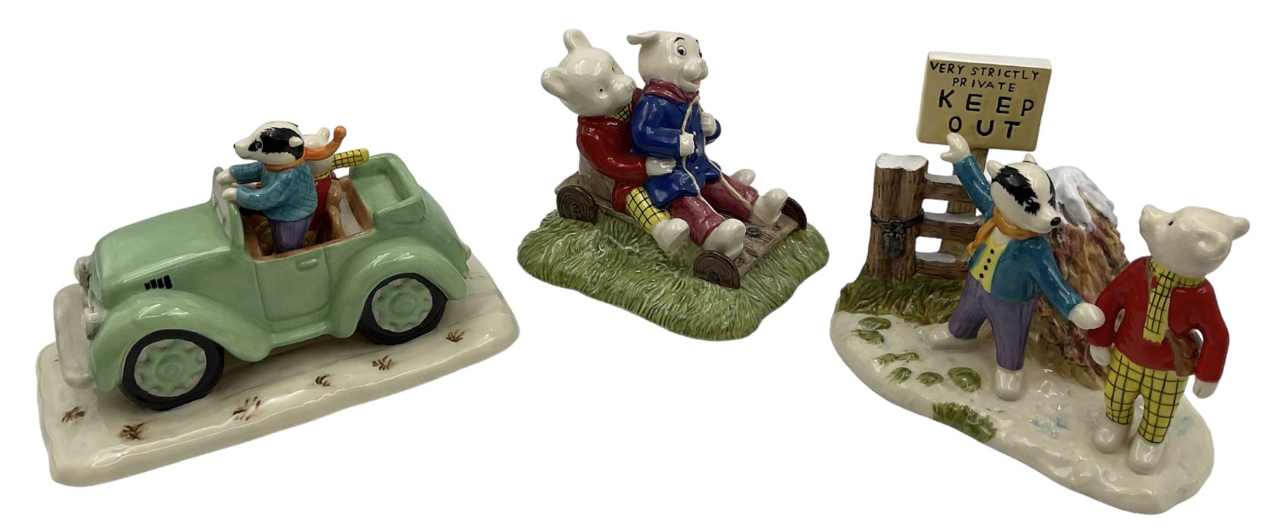 Two Royal Doulton Rupert Bear figure groups, comprising Rupert, Bill and the Mysterious Car RB11 and Temped to Trespass RB5, together with Rupert Bear and Algy Pud