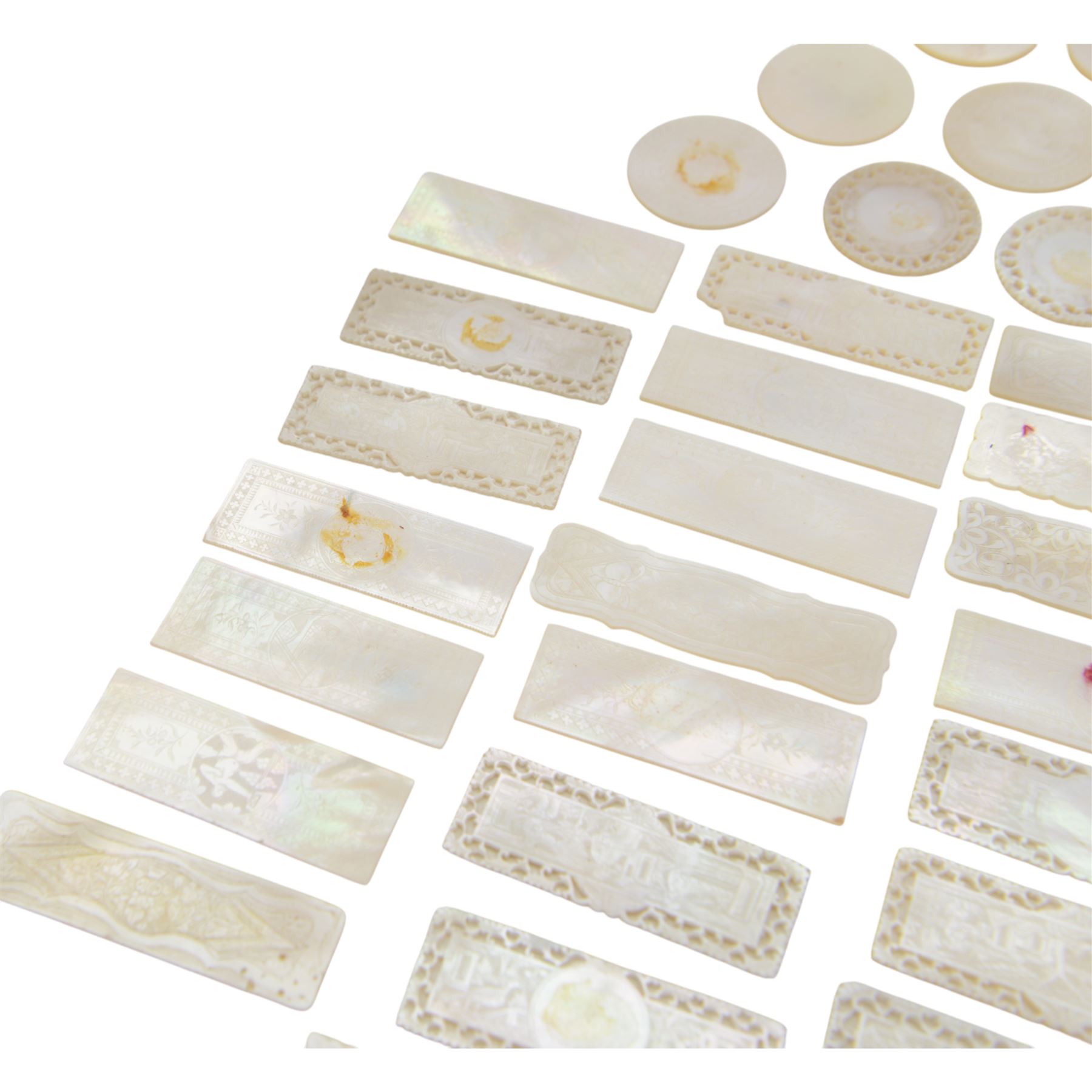 Chinese mother of pearl gaming tokens, of varying shape and design, including carved and engraved examples
