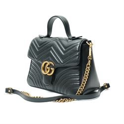 Gucci GG Marmont black matelassé leather top handle bag, made in Italy, with chevron quilted leather and heart motif to the reverse, antique gold-tone Double G front hardware, leather top handle and detachable chain shoulder strap with leather shoulder guard, front flap closure, suede-effect interior with zip pocket and leather logo tab stamped Gucci made in Italy, together with original Gucci dust bag and carrier, W27cm D11cm H20cm