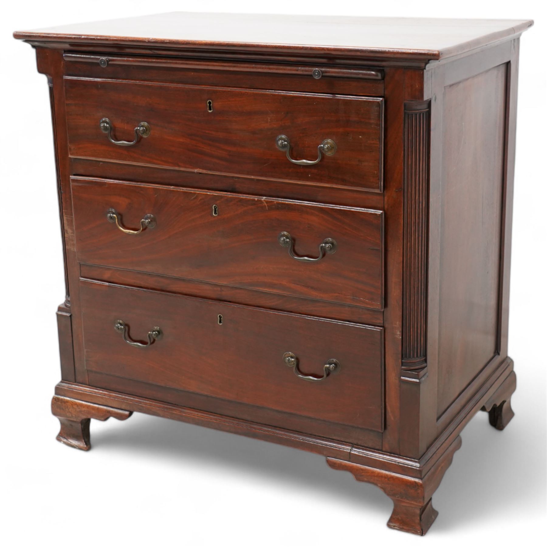Georgian mahogany bachelor's chest, brushing slide over three long drawers, enclosed by canted corners with fluted quarter columns, on ogee bracket feet