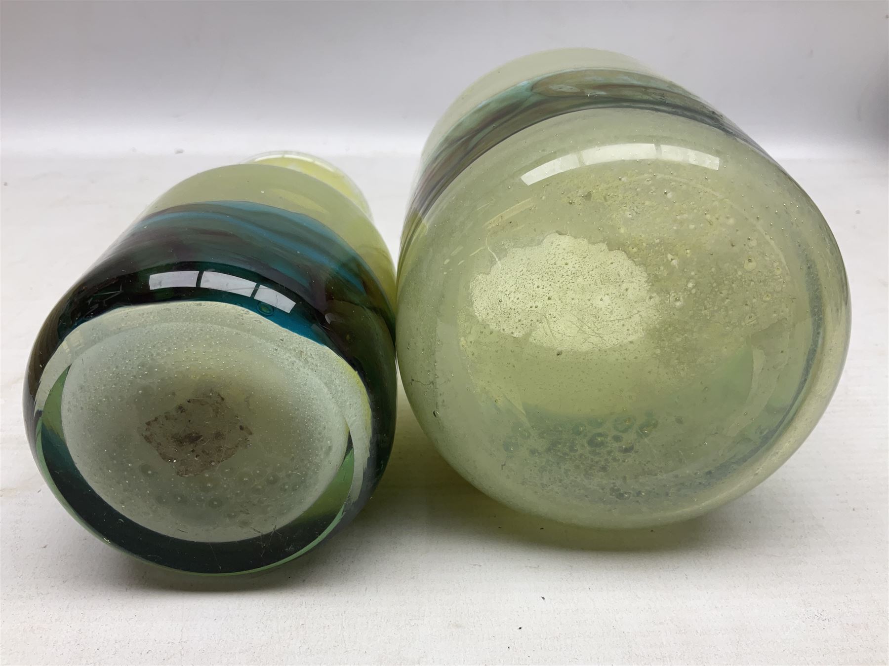 Mdina sea and sand glass vase, of cylindrical form, decorated in green, turquoise and brown, and matching vase, both unmarked together with a glass bowl and jug with gilt decoration 