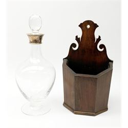 An Elizabeth II silver mounted clear glass decanter, hallmarked J A Campbell, London 1998, H30cm, together with a 19th century mahogany wall mounted candle holder, H28.5cm. (3). 
