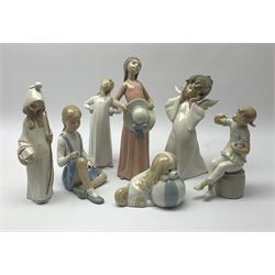 A group of six Lladro figures, together with a further Spanish figure modelled as a dog. 