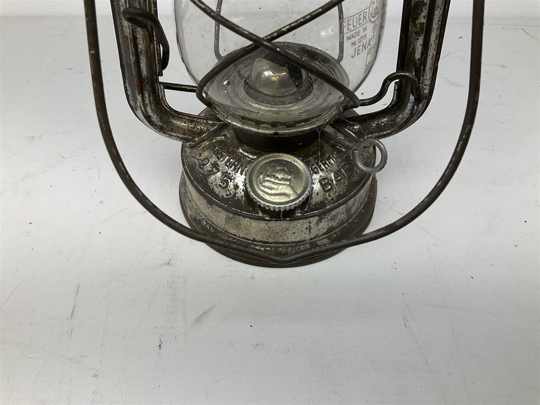 Copper and brass ship’s lamp marked ‘Anchor’, H25cm, Feuer hand storm lantern, Bialaddin Model 315 paraffin lamp and an Anchor lamp (4)