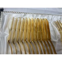 Bestecke Solingen canteen of gold plated cutlery for twelve place settings, including ladle, cake slice and serving spoons, contained within a briefcase, together with a matching set twelve of Bestecke Solingen gold plated fish knives and forks, in fitted case 