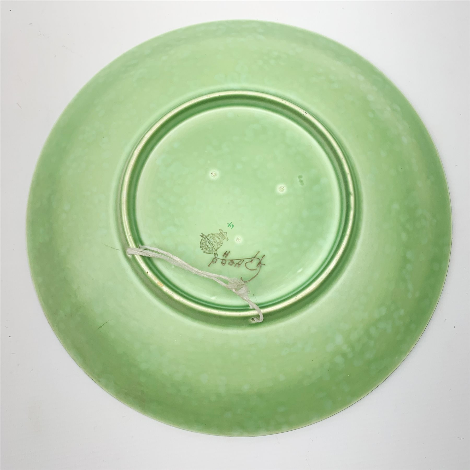 A Charlotte Rhead for Crown Ducal pattern pottery plate, decorated with a green dragon, with printed and painted marks beneath, D32cm.