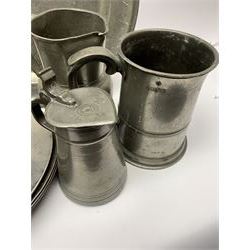 Collection of 18th and 19th century pewter, comprising two chargers, eight large plates, twenty six smaller plates, two bowls, three lidded measures, two jugs, tappit hen, and tankard, the plates with various marks and touch marks, including pseudo 'hallmarks', largest charger 37cm, large plates D30cm, smaller plates D24.5cm, tappit hen H26.5cm