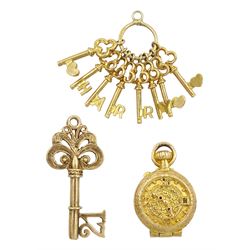 Three 9ct gold pendant/charms including clock and sand timer, 21 key and set of 'Harry' keys, all hallmarked